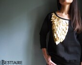 Black cotton sweat shirt embroidered with gold leather feathers