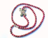 Rhodonite  semiprecious stones  long necklace with  Lapis Nevada carved Butterfly pendant.