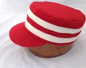 Fitted Boxcap in soft red wool flannel with two white wool bands. Size 7 3/8, supple leather sweatband. Other sizes and colors available