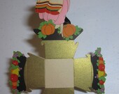 Art Deco unused 1920's-30's gold gilded thanksgiving Nut cup Die cut pilgrim Girl in pink dress holding basket of fruit pumpkins unused