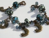Bronze Moon Charm Bracelet with Blue and Green Lampwork Beads and Blue Crystals
