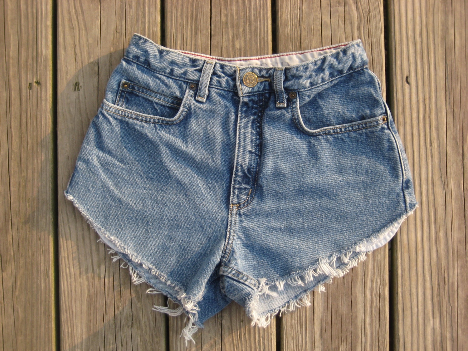 Vintage Lands End size 2 high waisted medium wash v-cut cutoffs higher on the sides