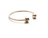 double skull cuff, bronze