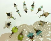 12 hand wrapped beaded dangles in shades of aqua and green 2 of each design