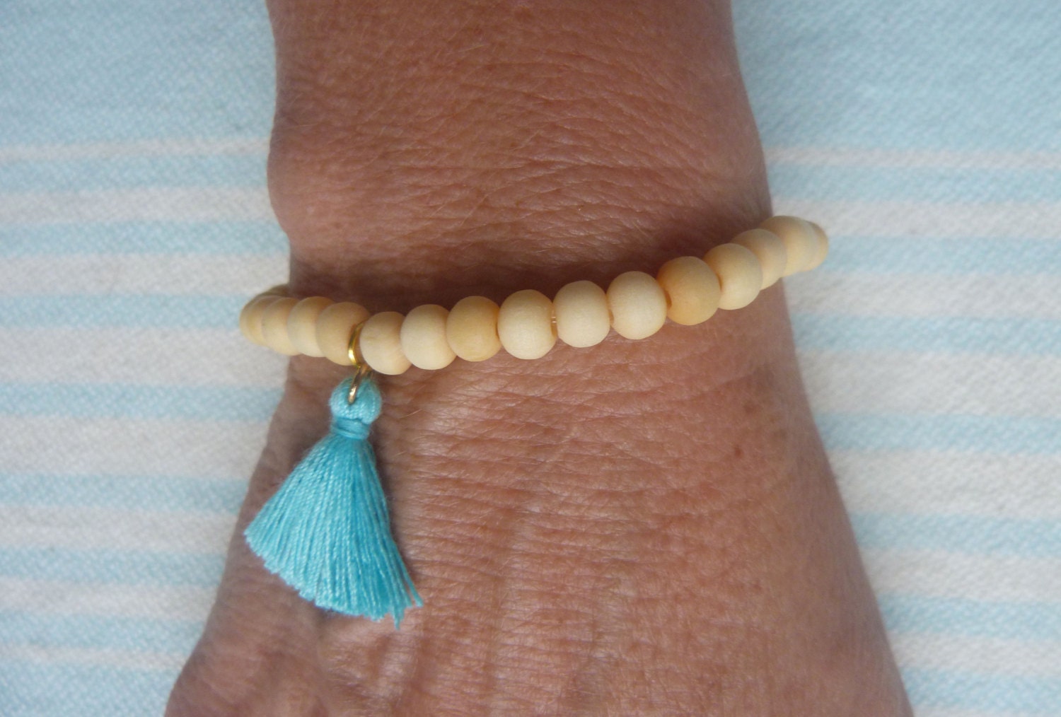 beachcomber natural wood turquoise tassel bracelet