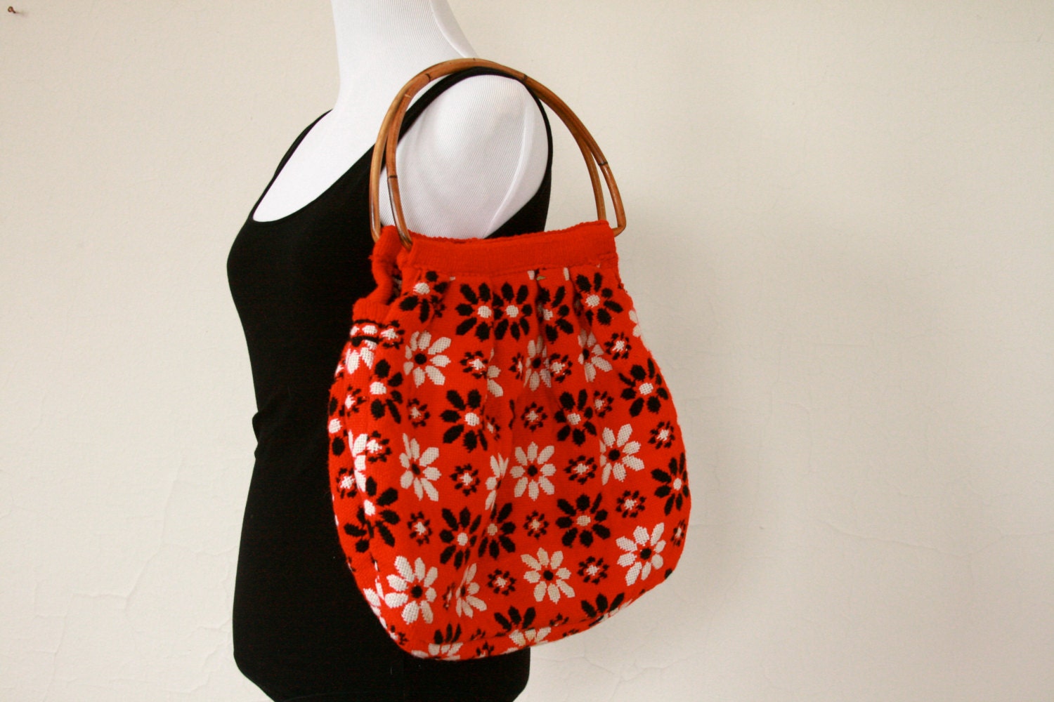 reversible knit floral print handbag. bamboo handles.