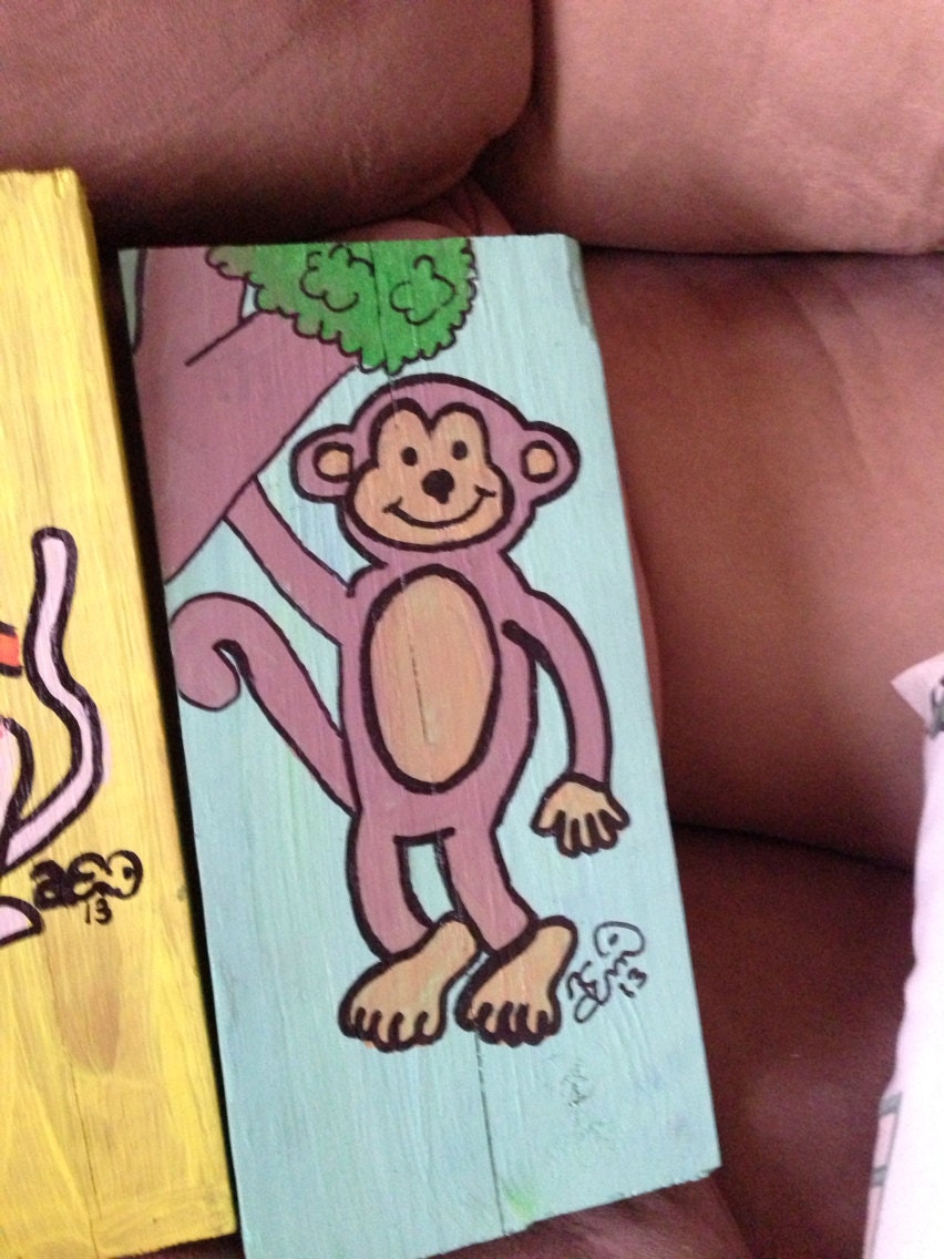 Monkey see, monkey do on wooden block