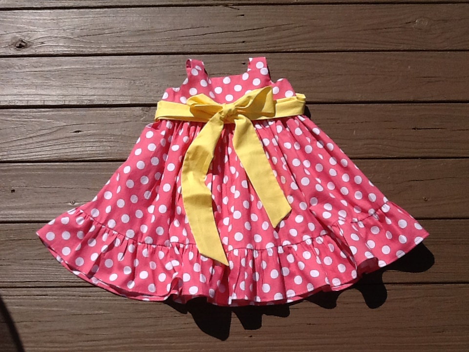 Girls Little Pink Dress with ruffle detail. Pink white polka dot. Yellow or custom sash. Custom children's clothing. By EverythingSorella
