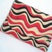 Tan, black and red medium cotton clutch