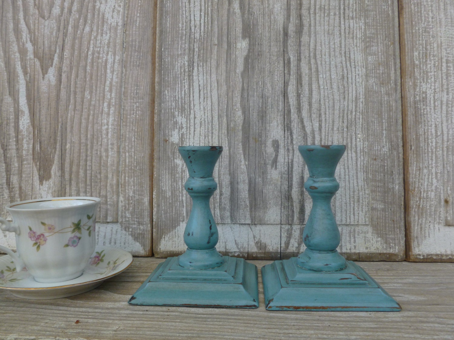 Pair of Turquoise Chippy Painted Candlesticks