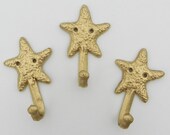 cast iron hook - starfish hooks - gold starfish - beach house decor - towel hanger - beachy bathroom decor - nautical nursery