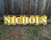 Personalized Family Name Sign on a rustic random wood canvas