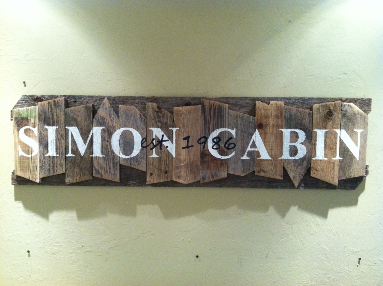 Personalized Family Name Sign on a rustic random wood canvas