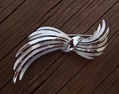 Vintage Trifari Brooch, Silver Tone Design in Nice Condition.  Signed on the Back.