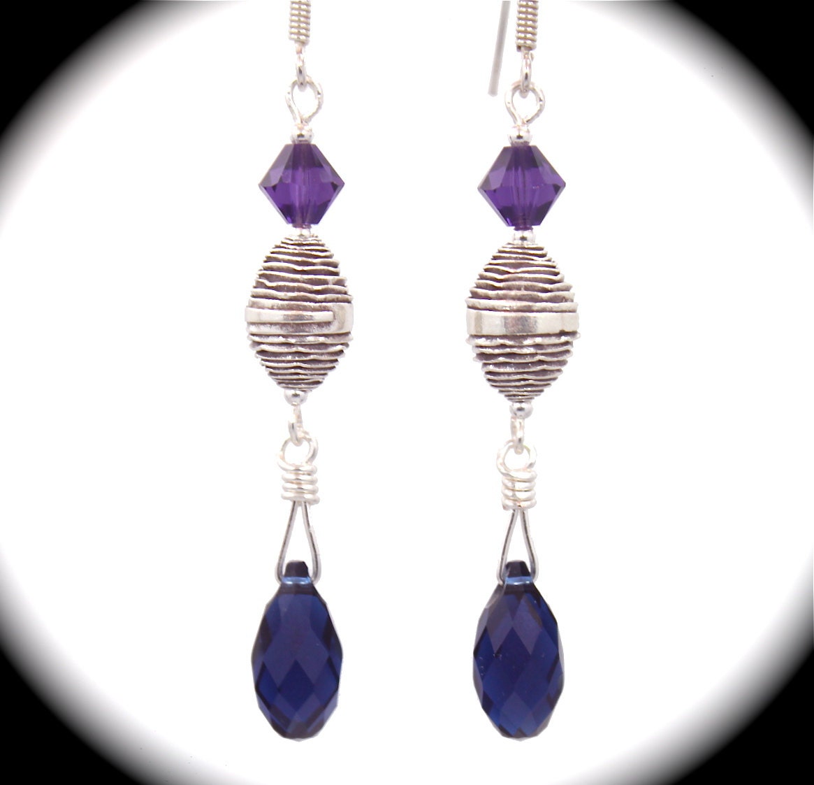Sterling silver earrings with amethyst and Swarovski briolettes and crystals.