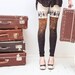 Beige and black rust color block leggings with tribal tiny people print