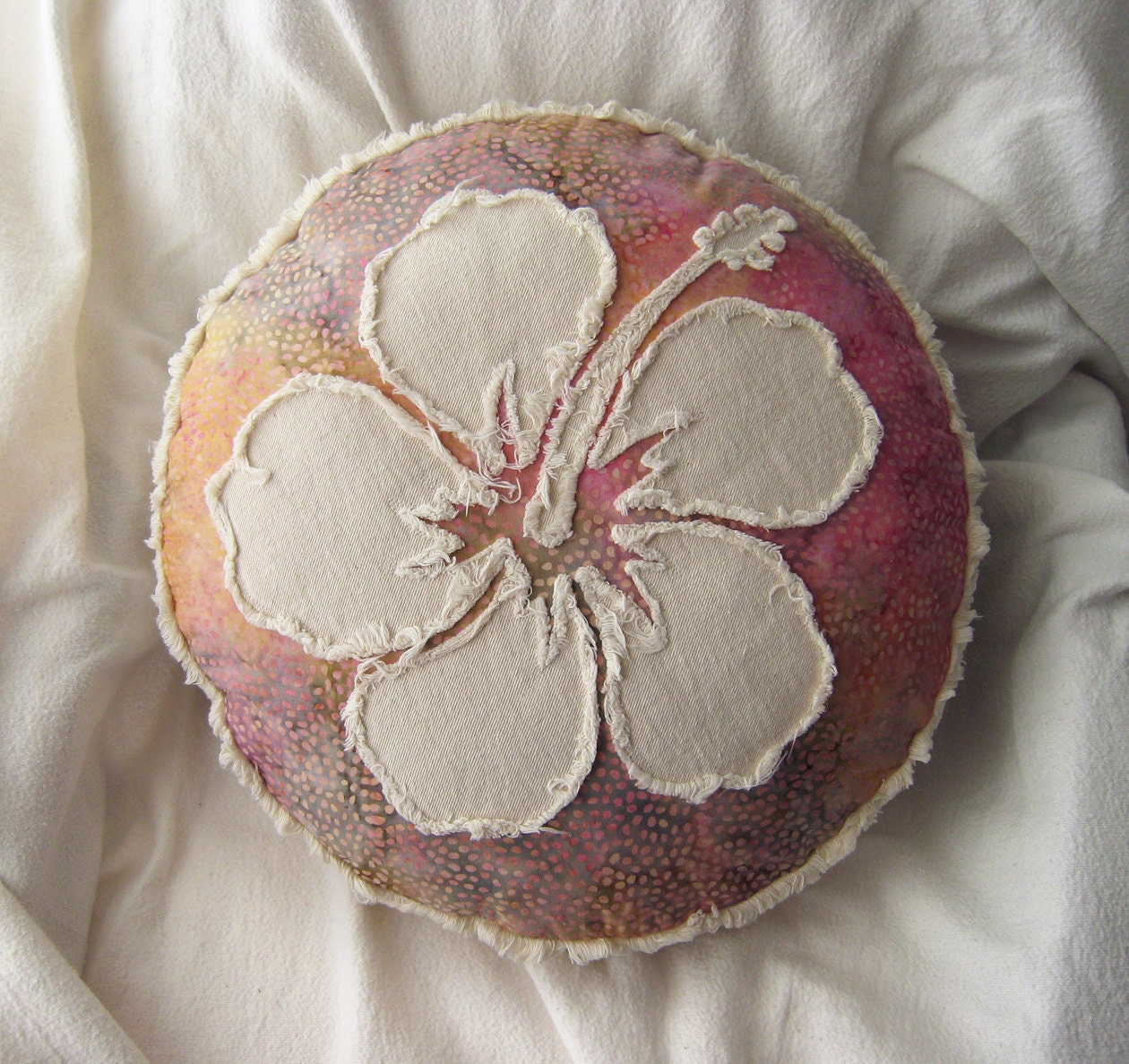 Hibiscus flower multi color batik in magenta, yellow gold, taupe, and natural denim round pillow