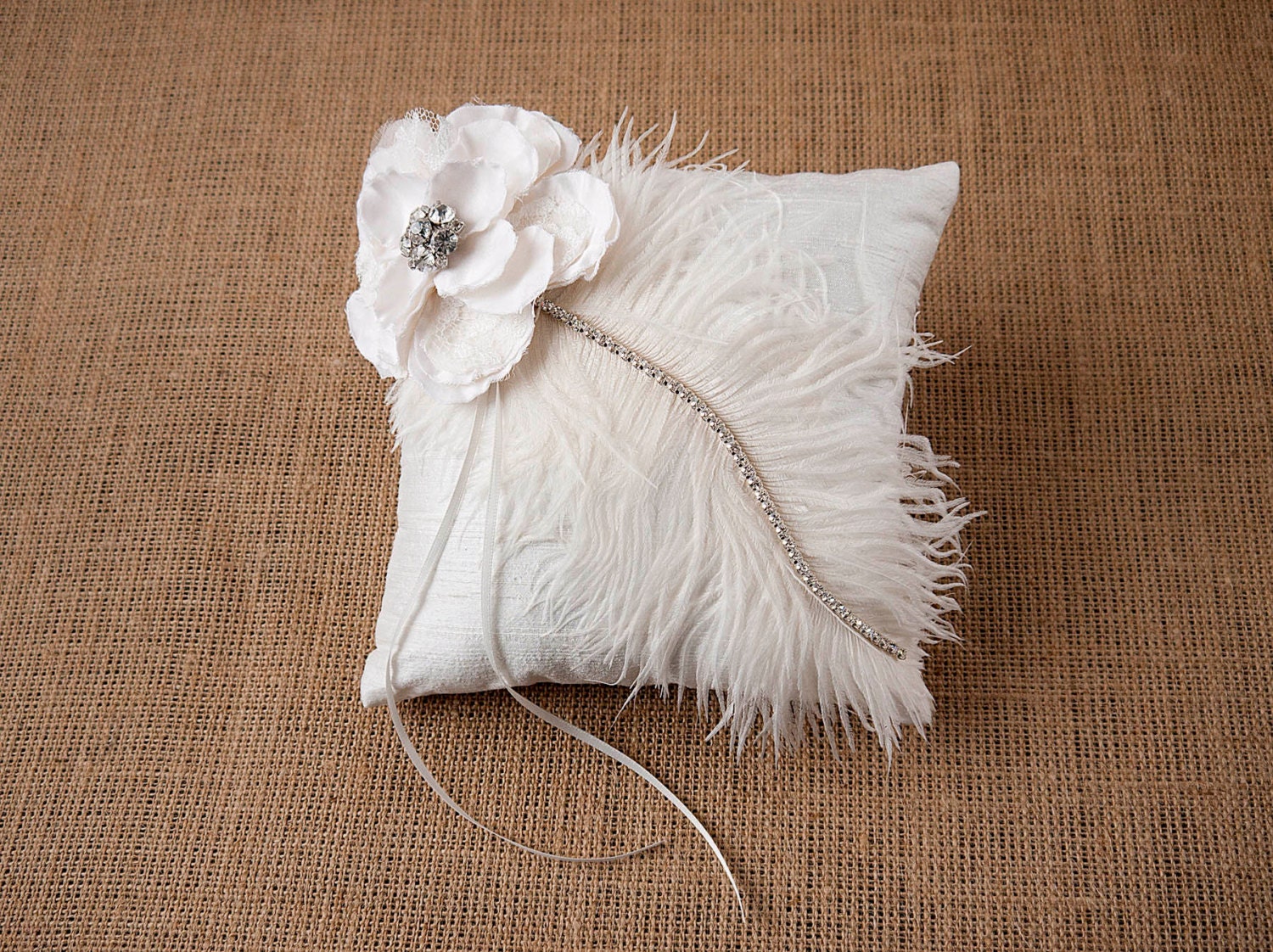Ella, raw silk ring bearer pillow with a handmade flower, crystal detail, ostrich feather and rhinestone strand