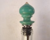Blue-dyed Ponderosa Pine wine bottle stopper, beautiful color and grain patterns.
