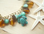 sunkissed beach golden brown and aqua charm bracelet with turtles