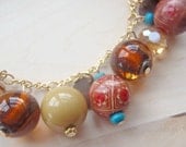 sunkissed beach golden brown and mustard charm bracelet