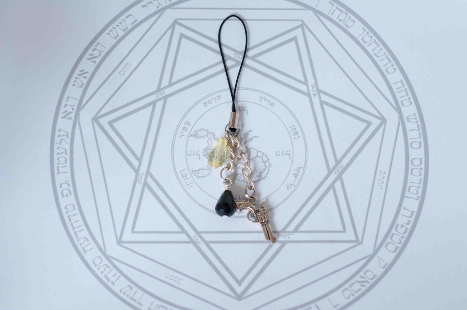 Azazel - Supernatural inspired phone charm with the colt, yellow and black beads