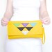 Geometric yellow felt clutch bag
