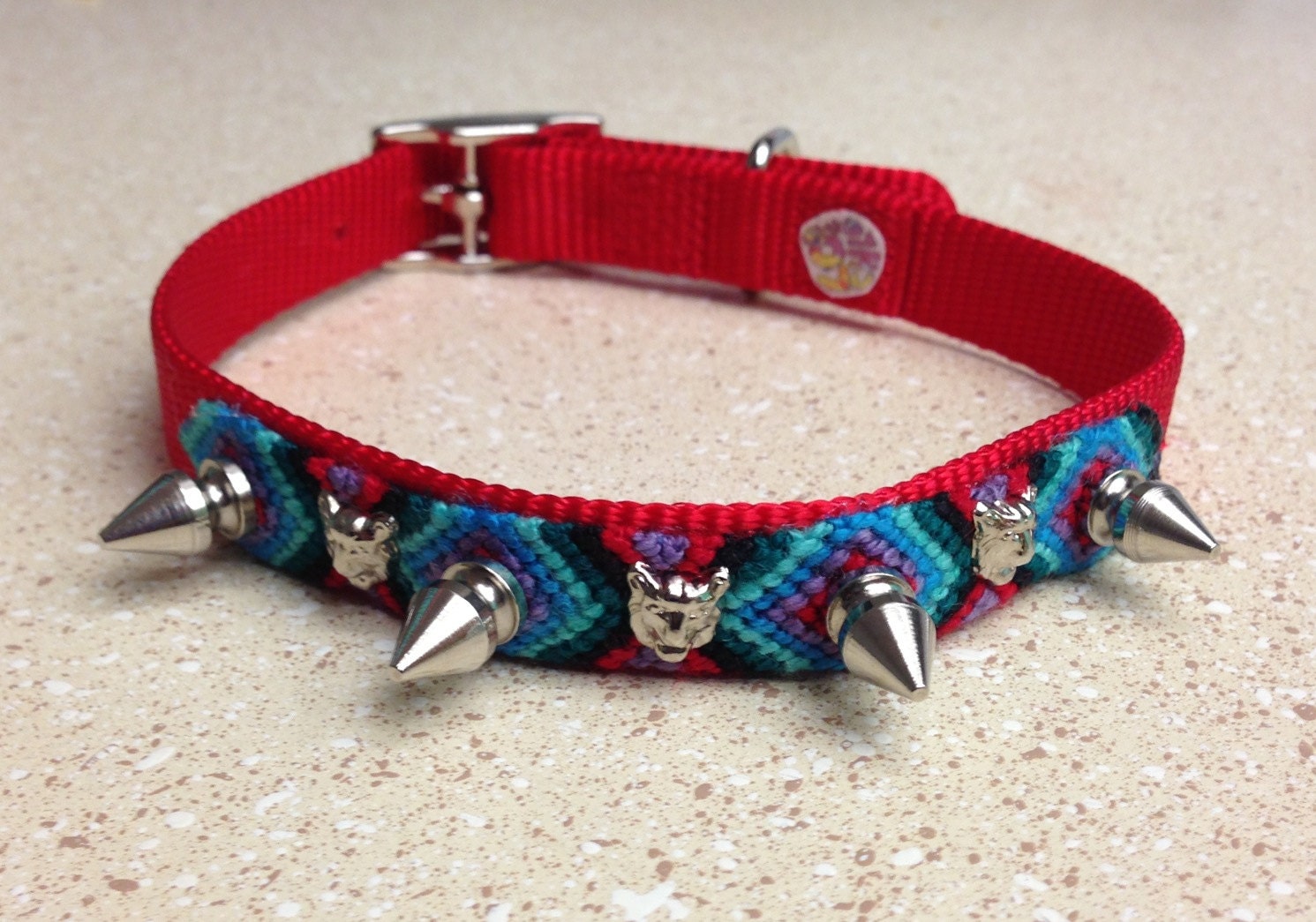 dog collar with silver pyramid studs and heart studs. the chlo chlo collar