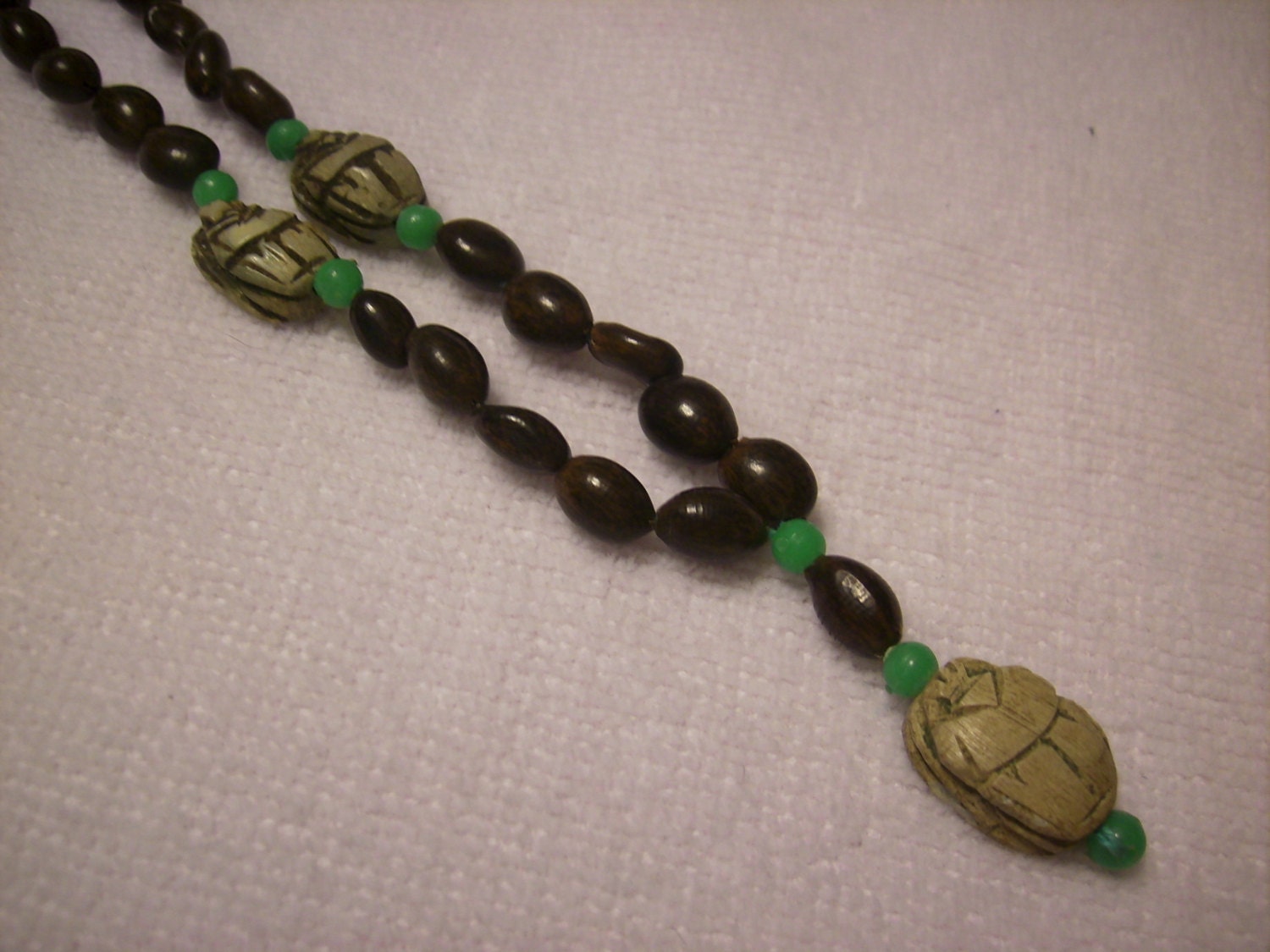 Art deco Egyptian scarab necklace. multiple scarabs with green beads & seeds.ooak