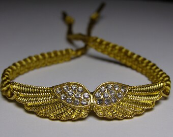 Angel wings bracelet with rhinestones  in golden metal and golden nylon cord