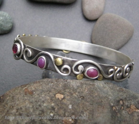 Bangle bracelet, handmade, one of a kind, flowing metalwork, sterling silver, red ruby cabochons, brass details