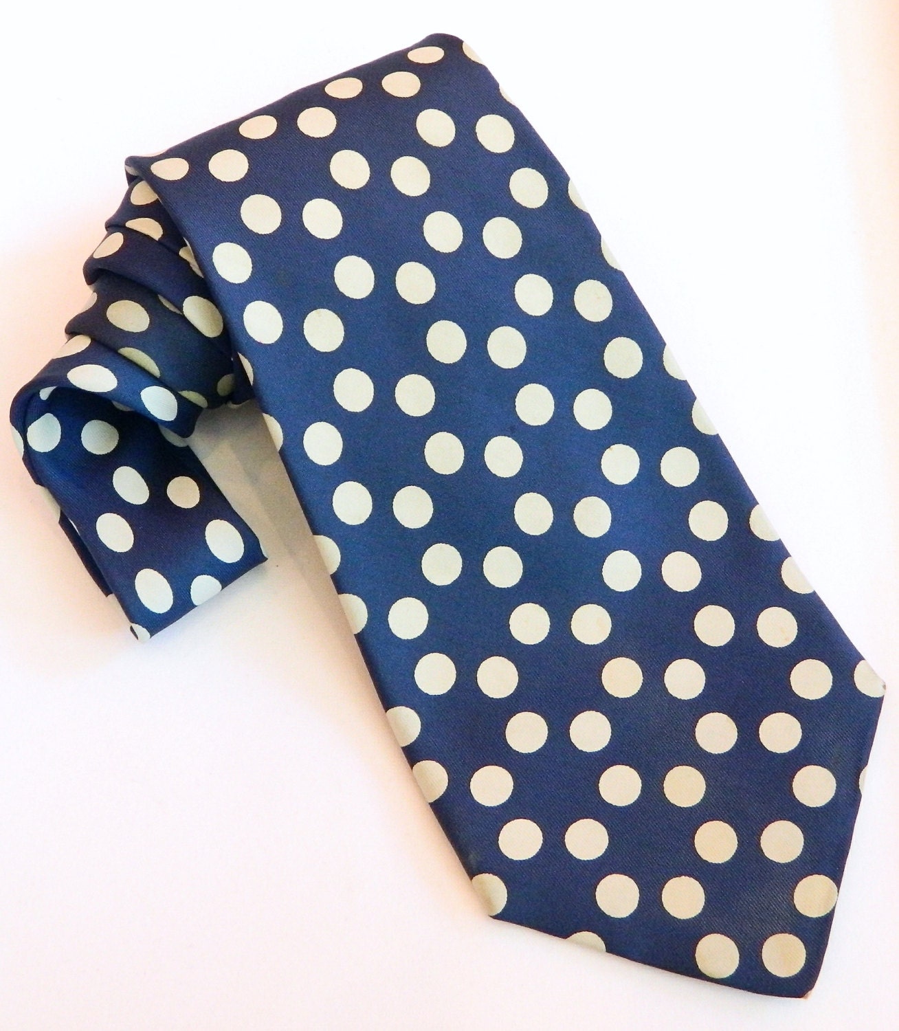 Mens Hermés Luxury Vintage  Swing Style silk tie in navy blue with repeating polka dot circle pattern