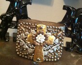 Leather cuff bracelet with vintage buckle and gold metal cross