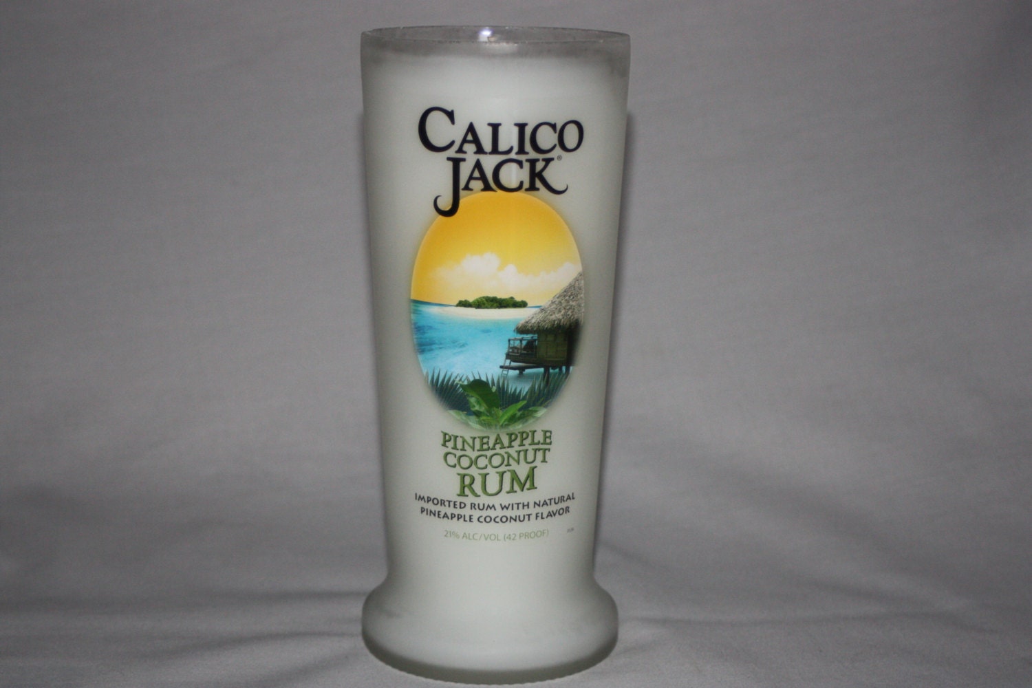 Recycled Liquor Bottle - Calico Jack - Candle - Scented in Coconut with Pineapple
