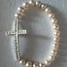 Sideways cross with white freshwater pearls
