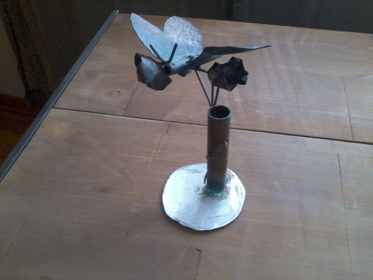Hand hammered, copper butterfly, flower piece on a stainless steel base