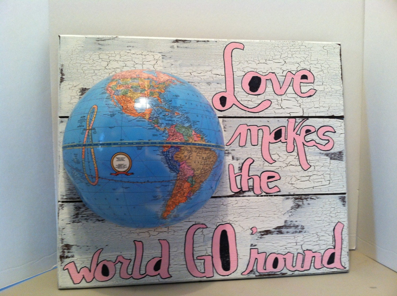Upcycled Love Makes the World go Round sign