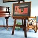 48" high easel with adjustable ledge. All Brass hardware. Made with Poplar wood stained and varnished 11x14 Item 0050