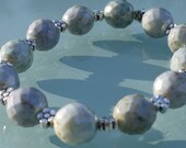Handmade bracelet in palest bluey greens and silver daisies