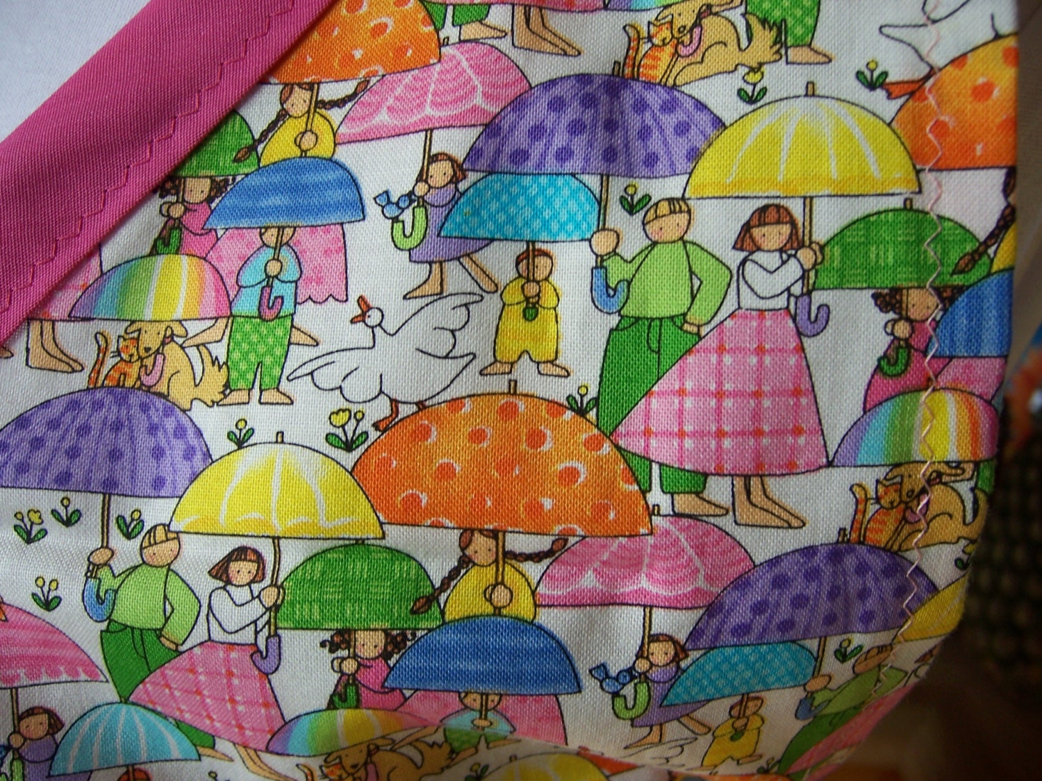 Vintage Style Full Apron with V-neck. Pink, purple, yellow and green umbrellas with Pink Gingham.