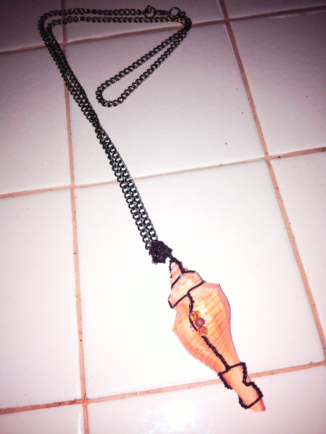 Wire wrapped sea shell with three glass bead, accent. Long strong chain. Handmade.