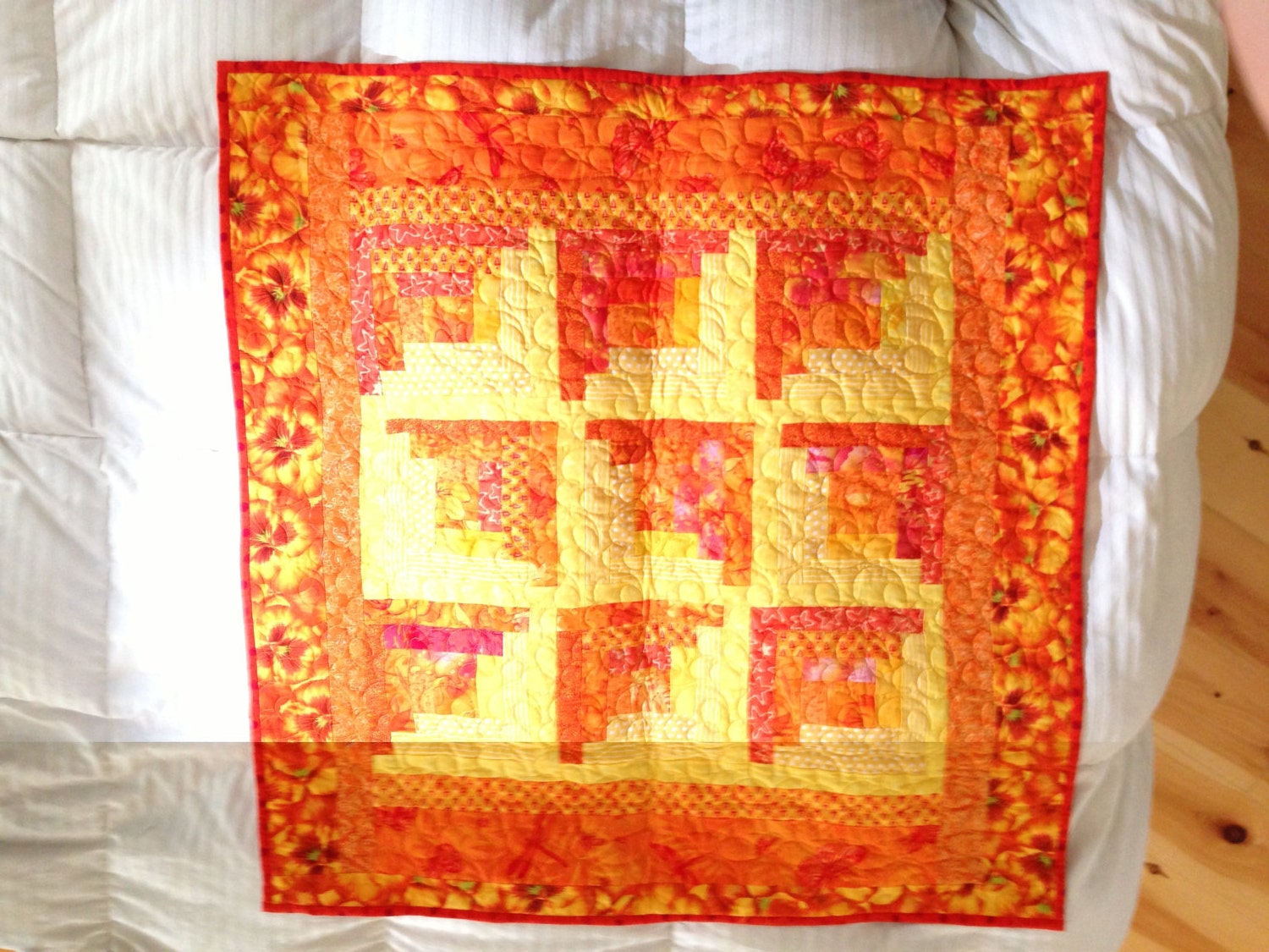 Orange, and yellow with printed cotton fabrics, machine quilted
