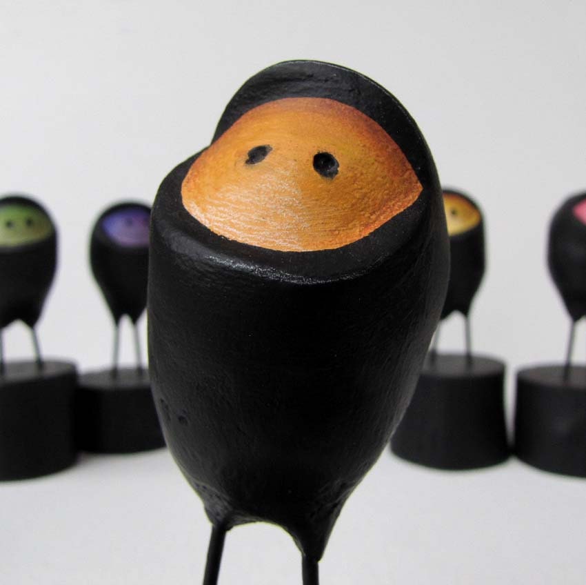 Paper Mache Orange Ninja Easter Egg  on wooden block