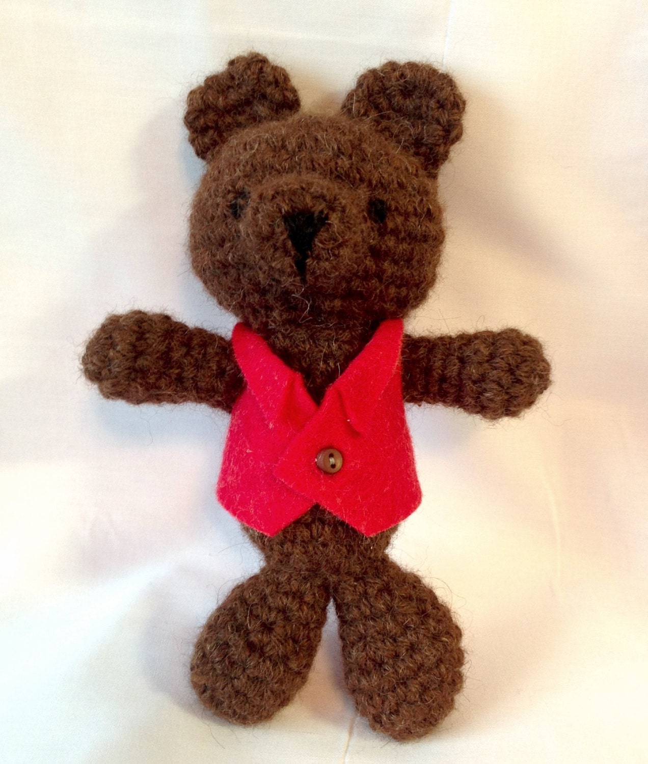 Small brown bear with a red jacket made with luxurious alpaca yarn