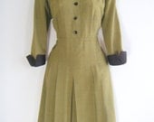 50s gabardine dress in olive with black satin cuffs and pointed collar, size large or US dress size 10