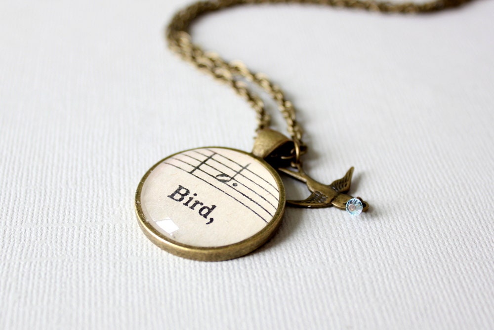 Bird Necklace made with vintage sheet music under glass.  One of a kind charm necklace with toggle clasp