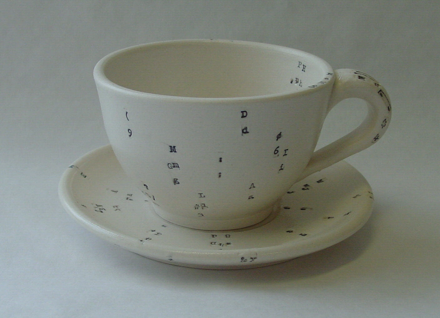 Typewriter Key Porcelain Cup and Saucer Set