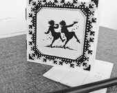 Black frame cross stitch embroidered perforated cardboard