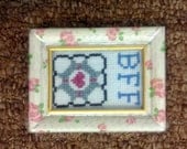 Companion Cube: Portal-inspired mini cross stitch in a vintage floral rose-patterned "shabby chic" frame, BFF