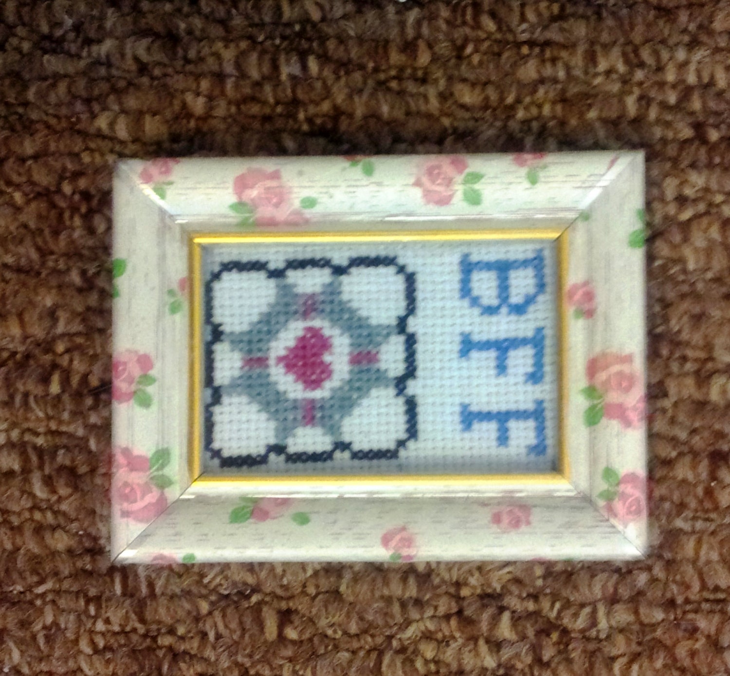 Companion Cube: Portal-inspired mini cross stitch in a vintage floral rose-patterned "shabby chic" frame, BFF